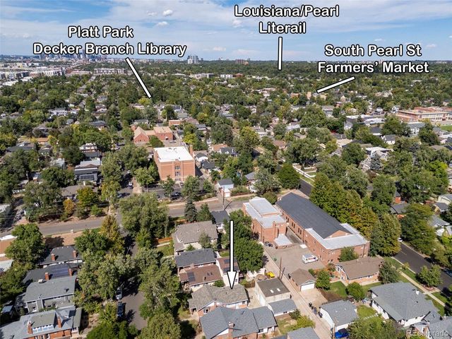 an aerial view of a houses with a city