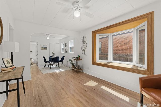 a view of a livingroom with furniture and a window