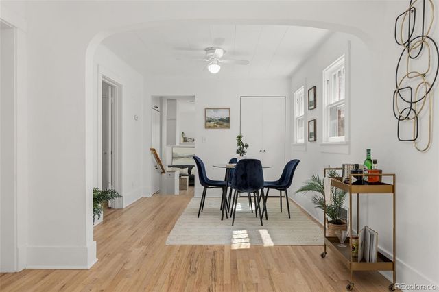 a view of a dining room with furniture and wooden floor