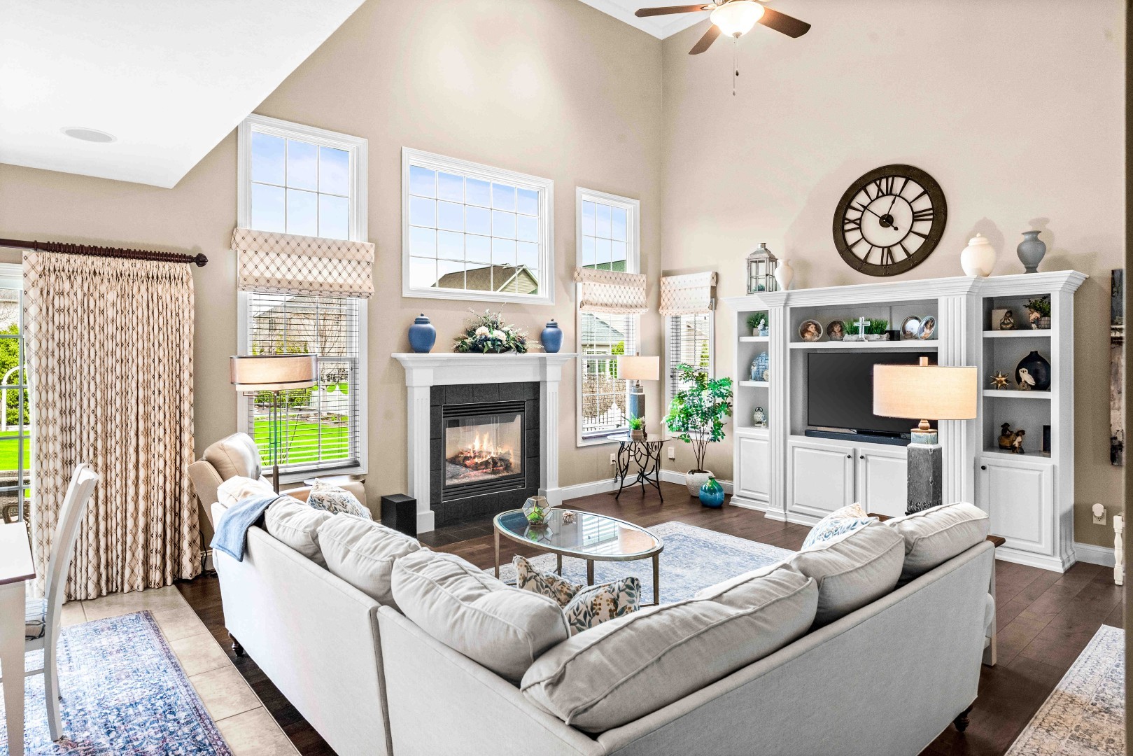 1048 Norway Court Normal, IL 61761 - Photo 14 of 83 a living room with furniture a large window and a fireplace