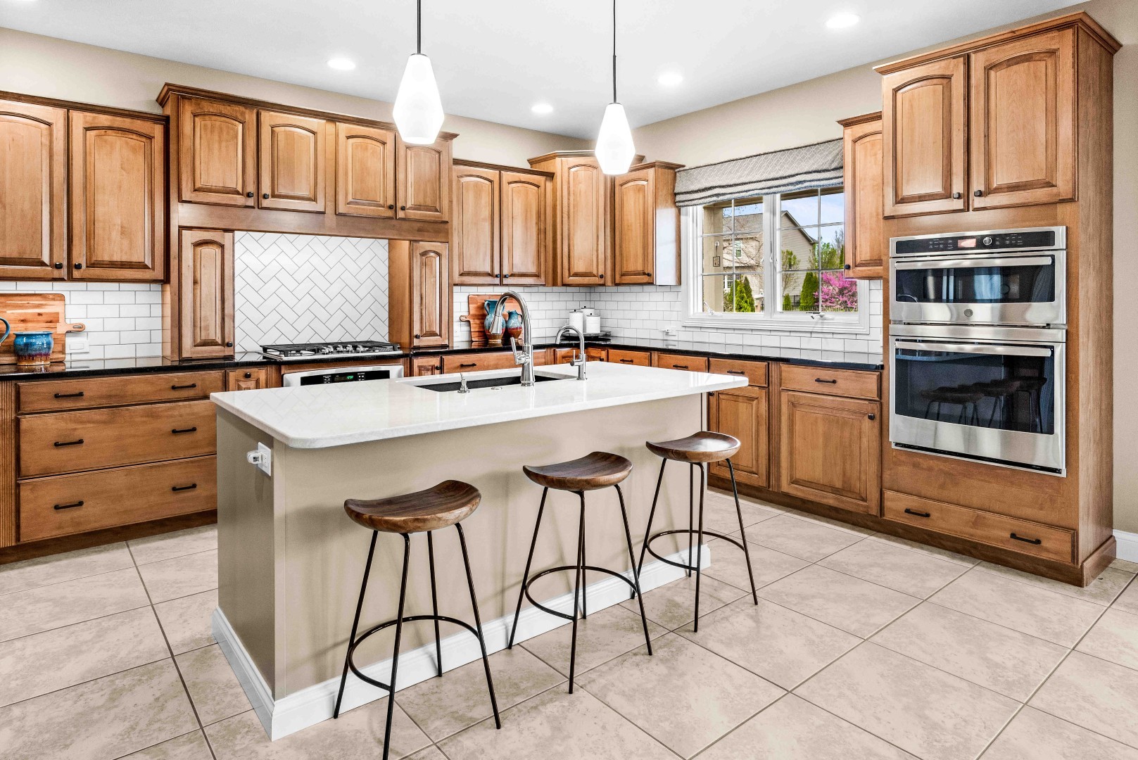 1048 Norway Court Normal, IL 61761 - Photo 20 of 83 a kitchen with stainless steel appliances granite countertop a stove a sink and a refrigerator