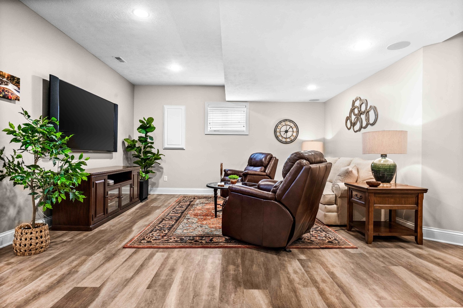1048 Norway Court Normal, IL 61761 - Photo 45 of 83 a living room with furniture a potted plant and a flat screen tv