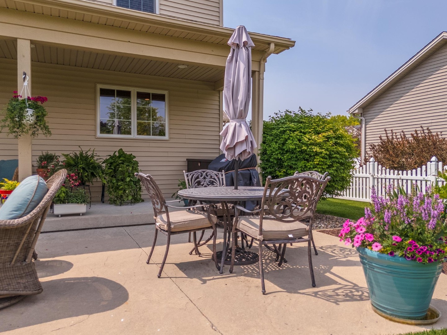 1048 Norway Court Normal, IL 61761 - Photo 62 of 83 a patio with a table and chairs and potted plants