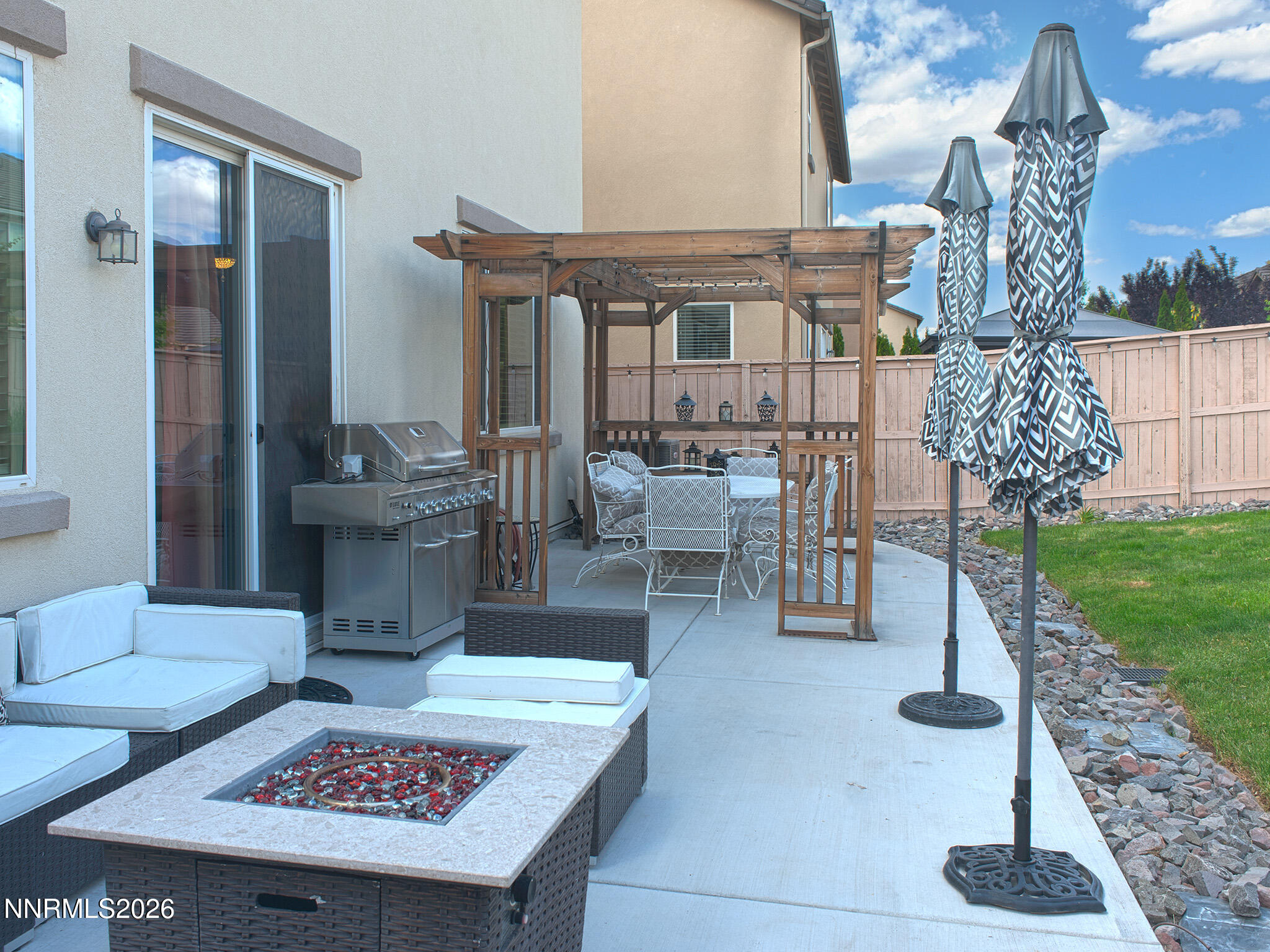 9766 Pachuca Drive Reno, NV 89521 - Photo 55 of 59 a view of a patio with dining table and chairs