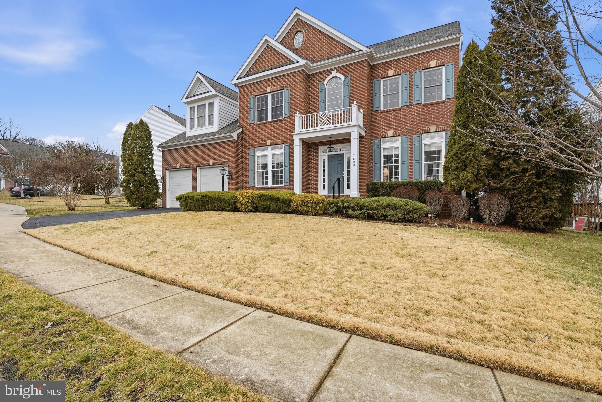 7820 Rose Garden Lane Springfield, VA 22153 - Photo 1 of 65 a front view of a house with a yard