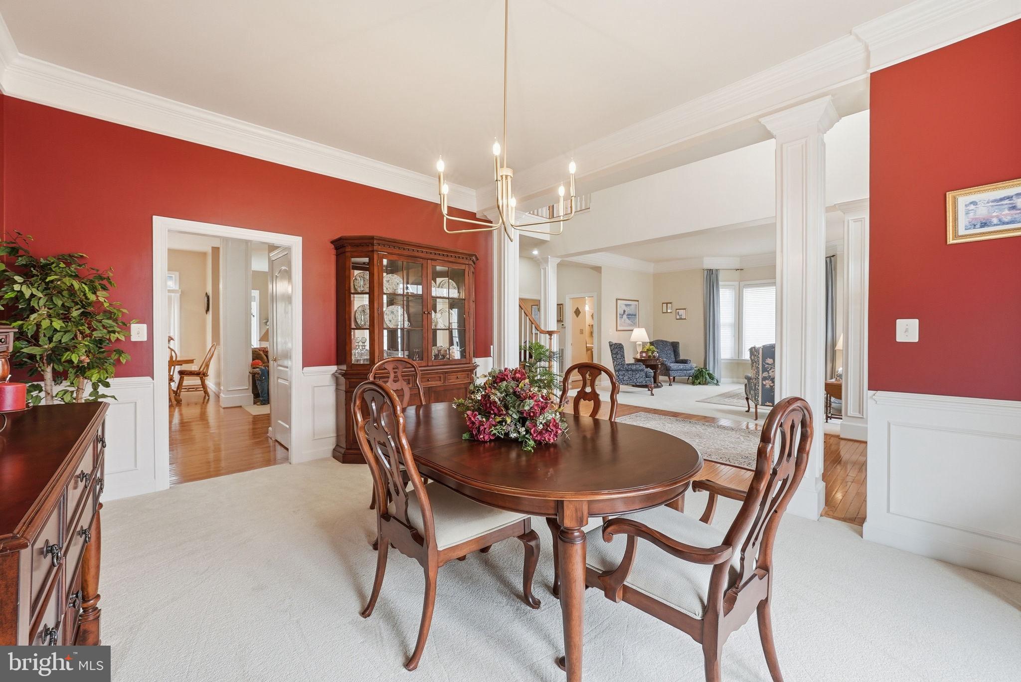 7820 Rose Garden Lane Springfield, VA 22153 - Photo 11 of 65 a view of a dining room with furniture and chandelier