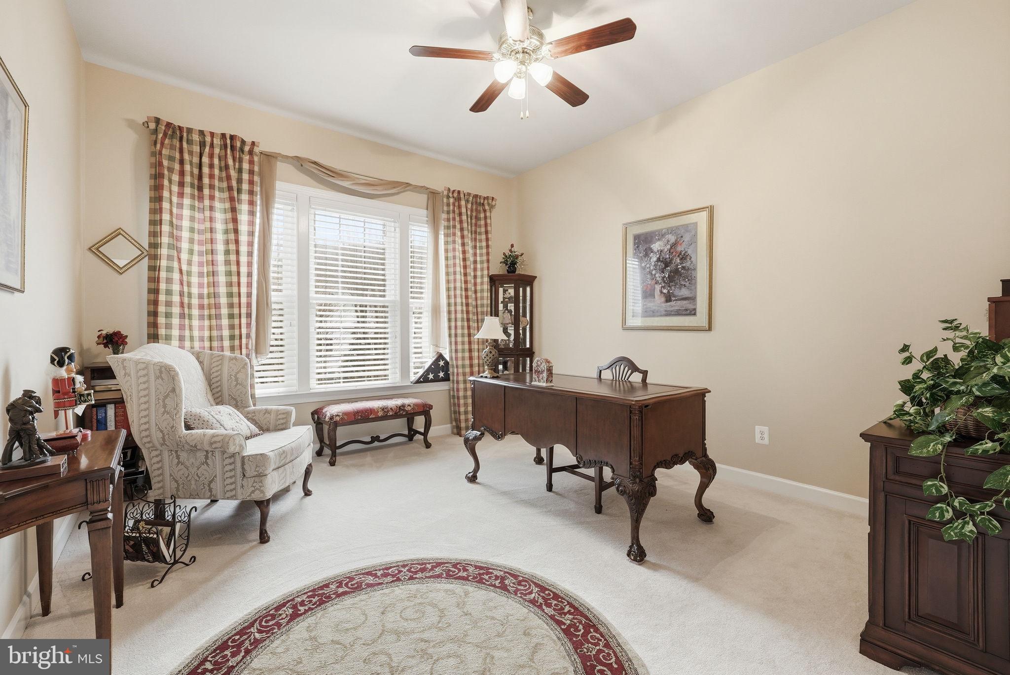 7820 Rose Garden Lane Springfield, VA 22153 - Photo 14 of 65 a living room with furniture and a large window
