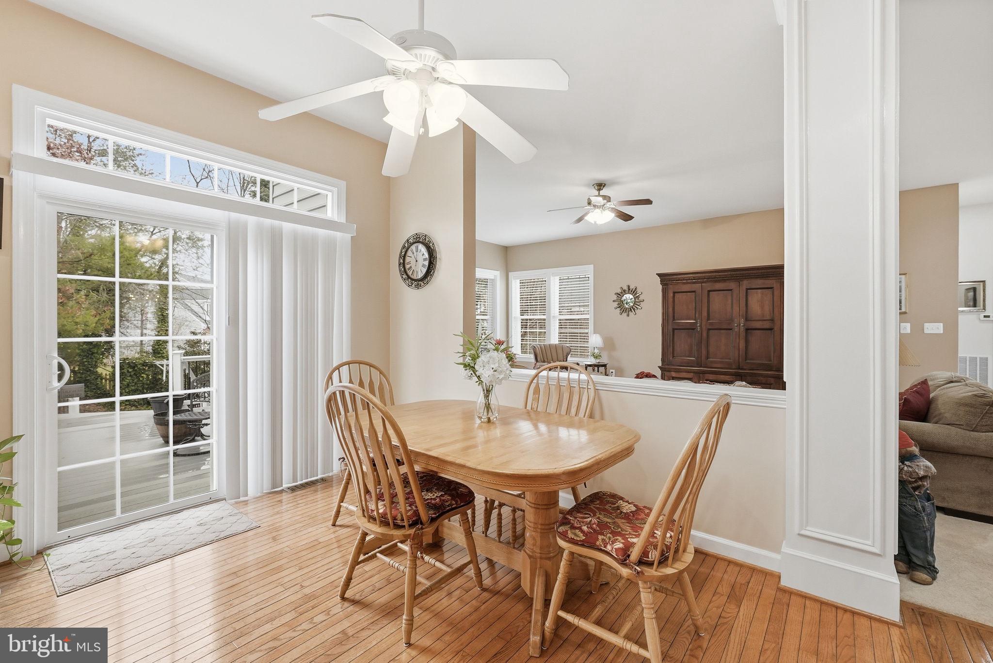 7820 Rose Garden Lane Springfield, VA 22153 - Photo 20 of 65 a view of a dining room with furniture window and wooden floor