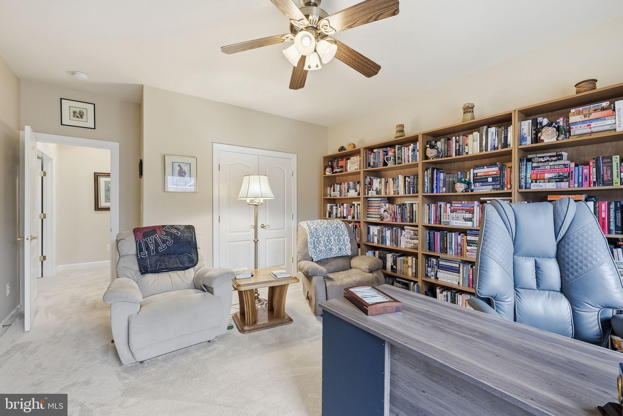 7820 Rose Garden Lane Springfield, VA 22153 - Photo 40 of 65 a living room with furniture and a book shelf