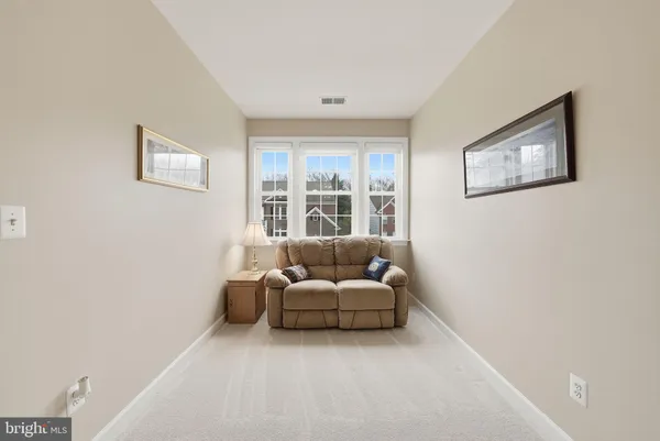 a view of a patio with table and chairs and potted plants