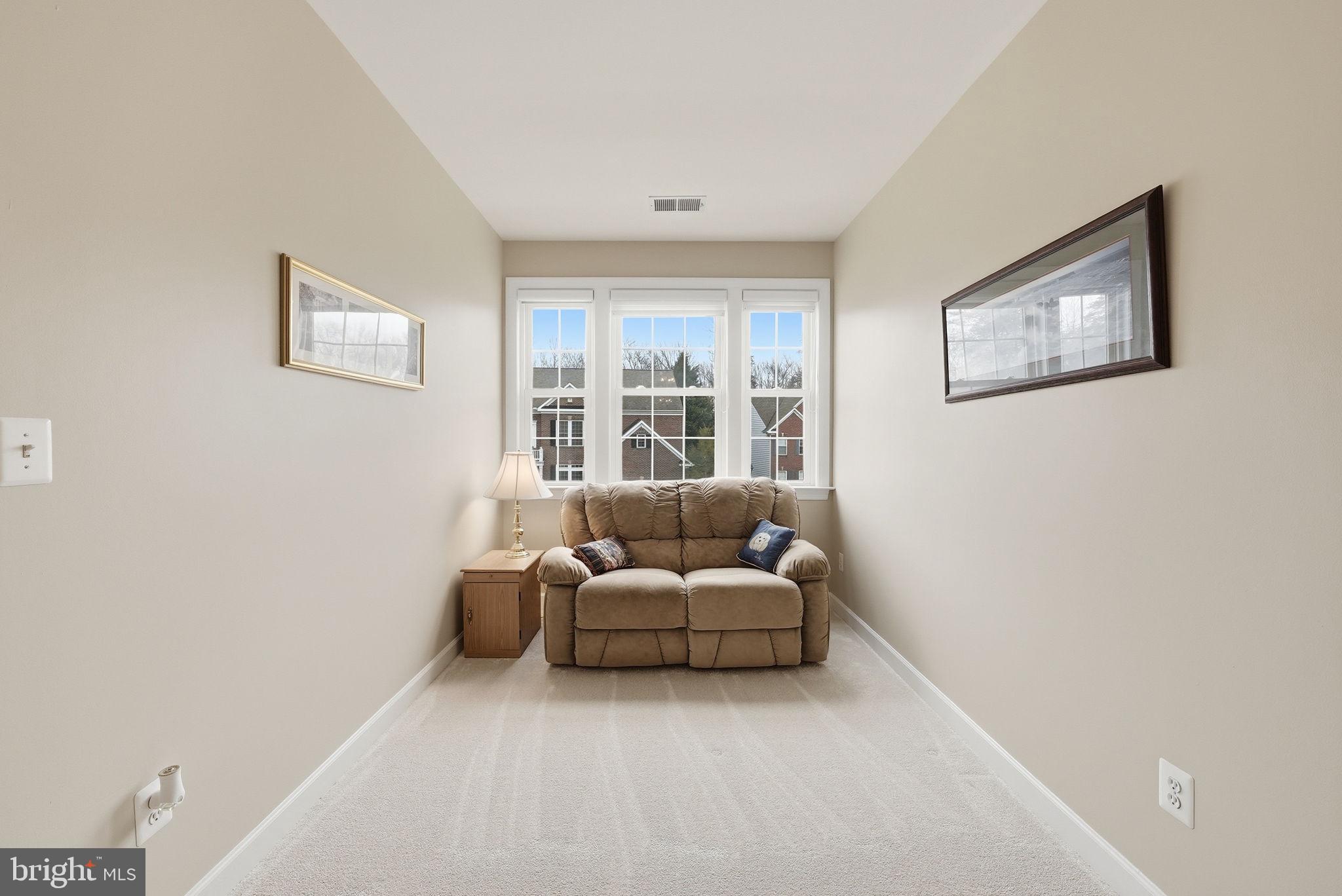 7820 Rose Garden Lane Springfield, VA 22153 - Photo 46 of 65 a living room with furniture and a window