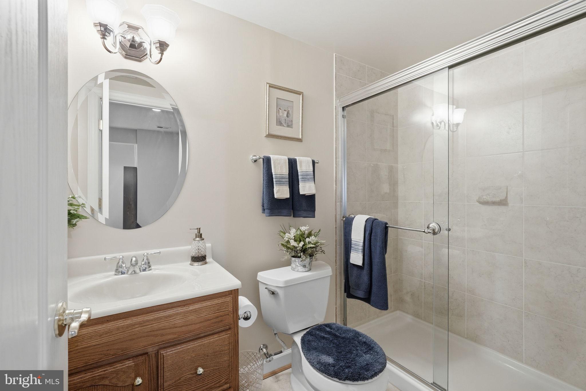7820 Rose Garden Lane Springfield, VA 22153 - Photo 53 of 65 a bathroom with a sink toilet and shower