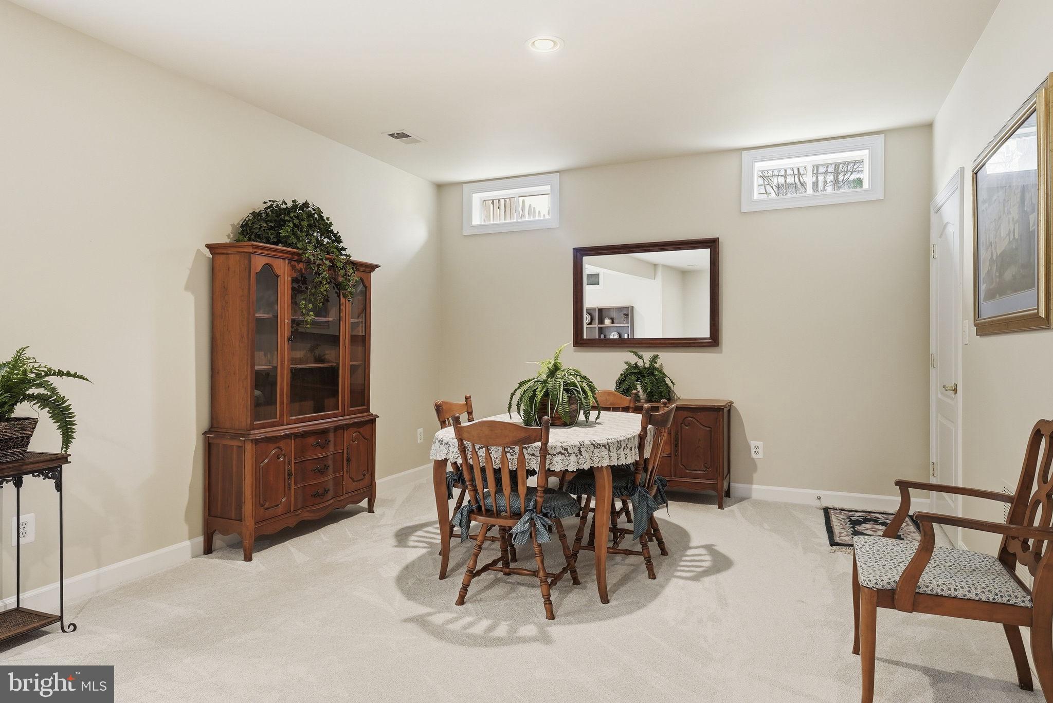 7820 Rose Garden Lane Springfield, VA 22153 - Photo 54 of 65 a view of a dining room with furniture