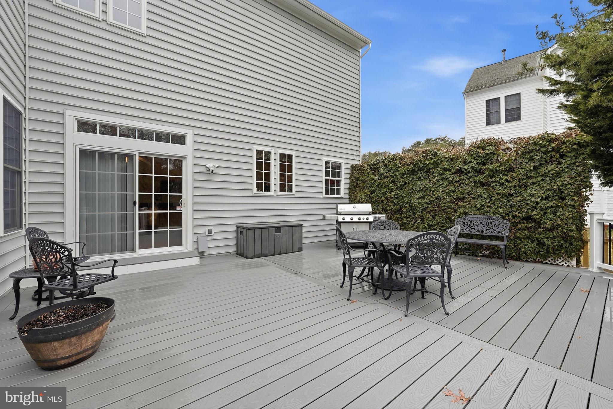 7820 Rose Garden Lane Springfield, VA 22153 - Photo 57 of 65 a view of a patio with table and chairs and potted plants
