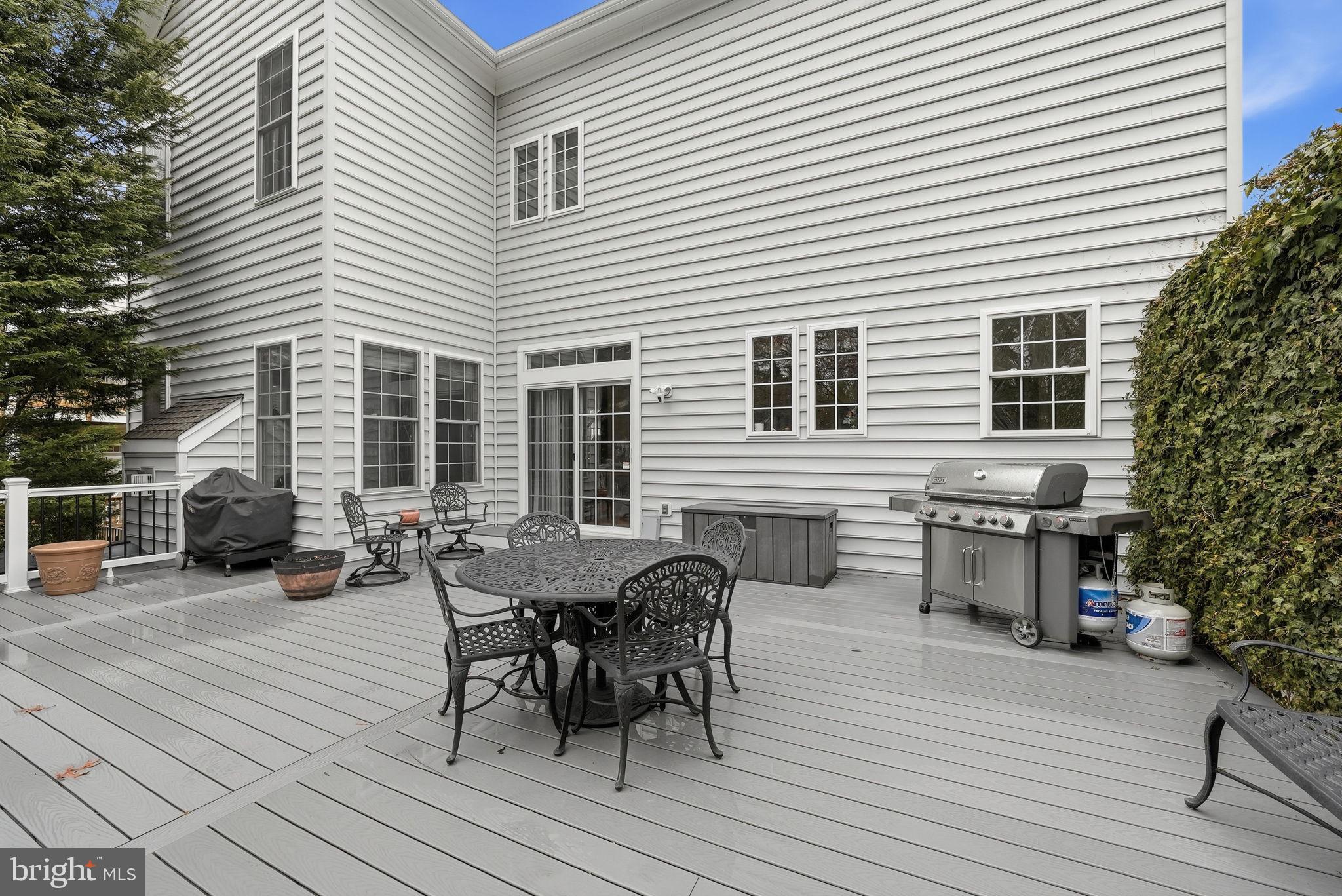 7820 Rose Garden Lane Springfield, VA 22153 - Photo 58 of 65 a view of a dinning table and chairs in patio of the house