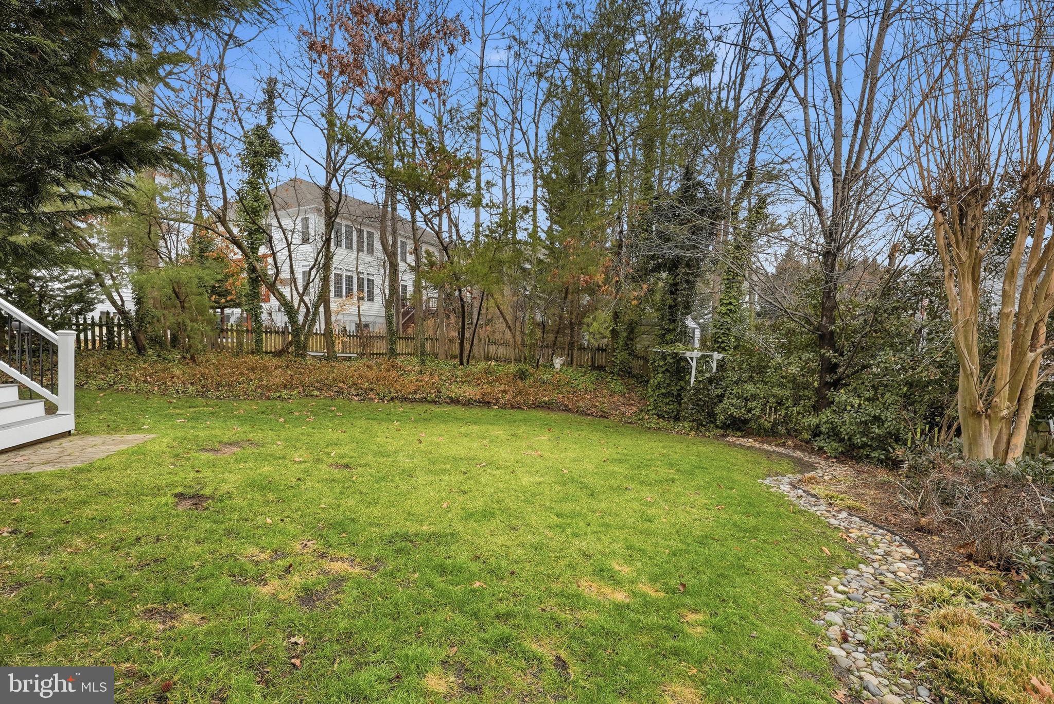 7820 Rose Garden Lane Springfield, VA 22153 - Photo 60 of 65 a backyard of a house with lots of green space