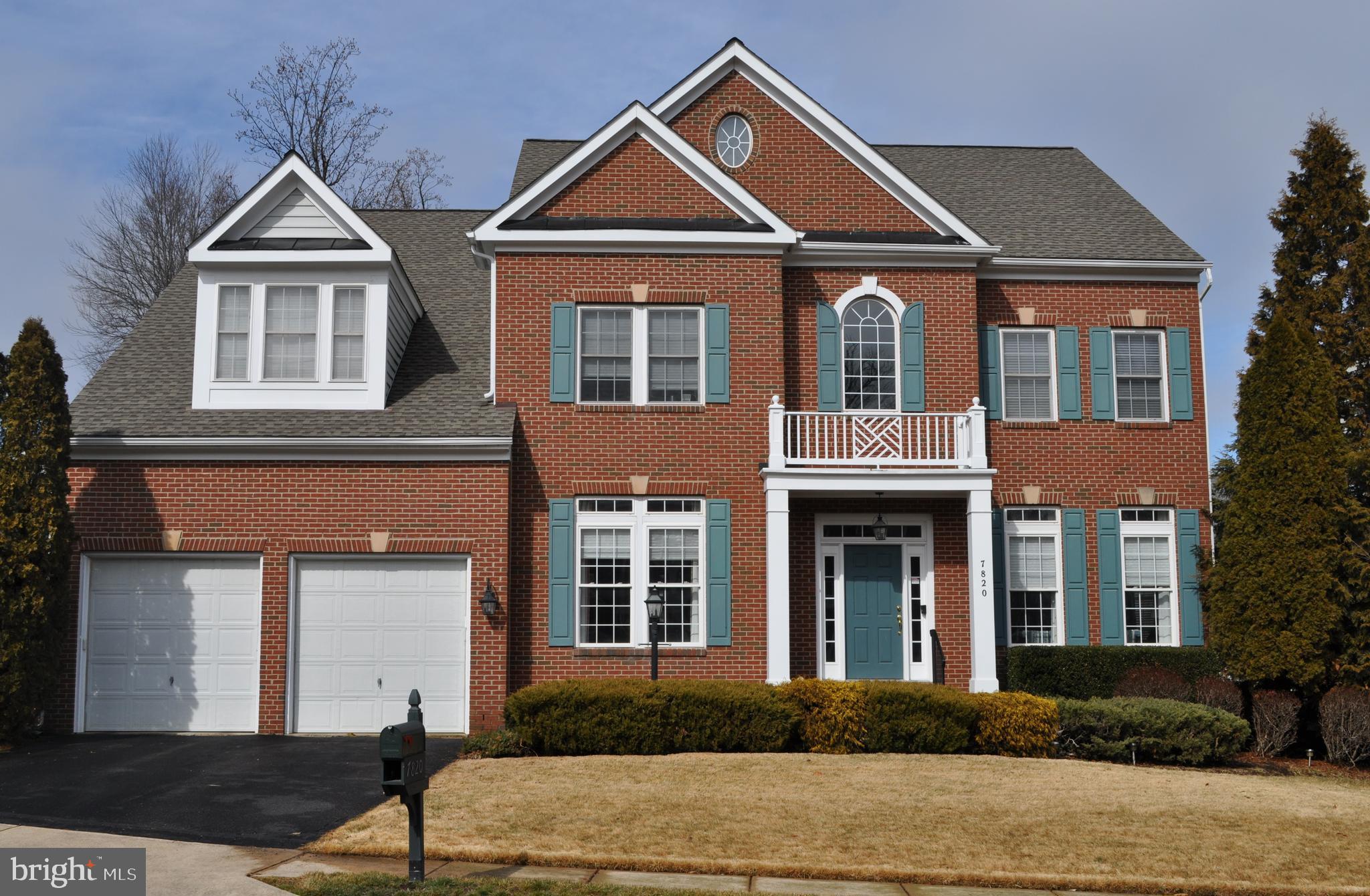 7820 Rose Garden Lane Springfield, VA 22153 - Photo 61 of 65 front view of a house with a yard