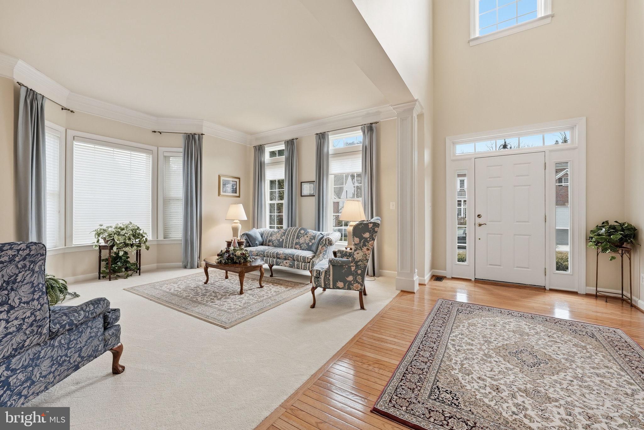 7820 Rose Garden Lane Springfield, VA 22153 - Photo 7 of 65 a living room with furniture and a rug