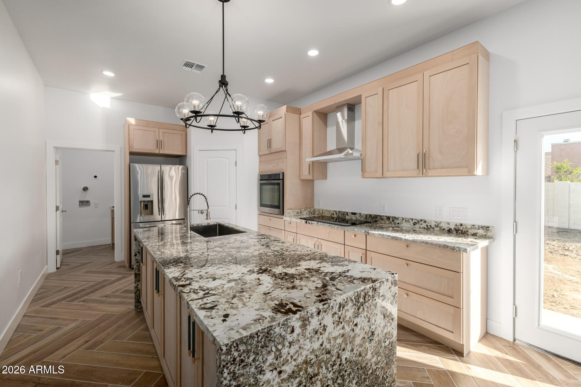 6345 West Grandview Road Glendale, AZ 85306 - Photo 15 of 36 a kitchen with stainless steel appliances granite countertop a stove and a refrigerator