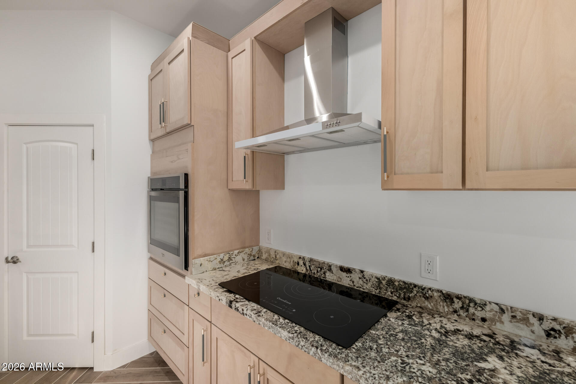 6345 West Grandview Road Glendale, AZ 85306 - Photo 16 of 36 a kitchen with granite countertop a sink and a stove