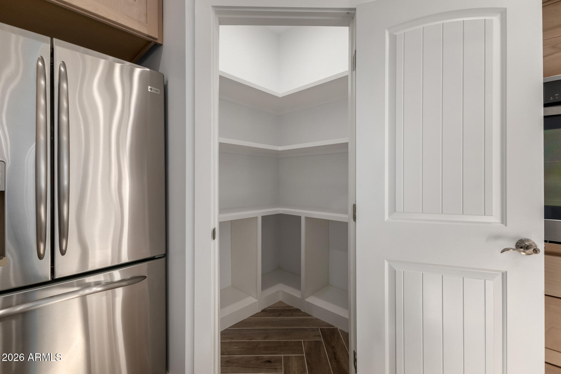 6345 West Grandview Road Glendale, AZ 85306 - Photo 18 of 36 a view of walk in closet with empty racks