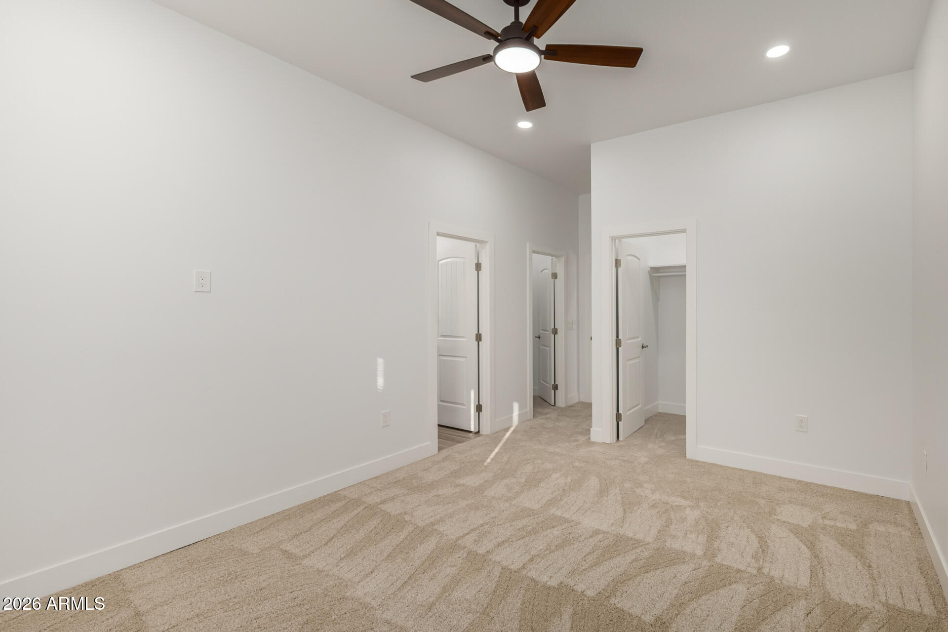 6345 West Grandview Road Glendale, AZ 85306 - Photo 20 of 36 an empty room with closet and a ceiling fan