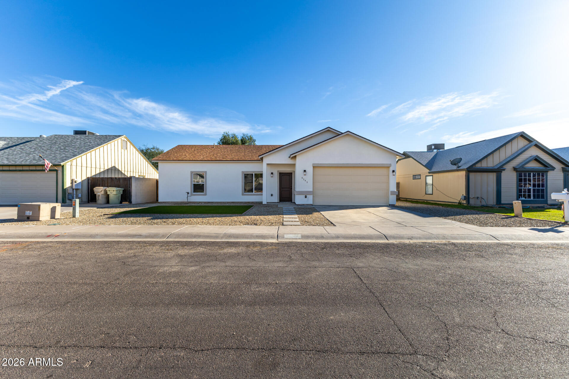 6345 West Grandview Road Glendale, AZ 85306 - Photo 2 of 36 a front view of a house with street