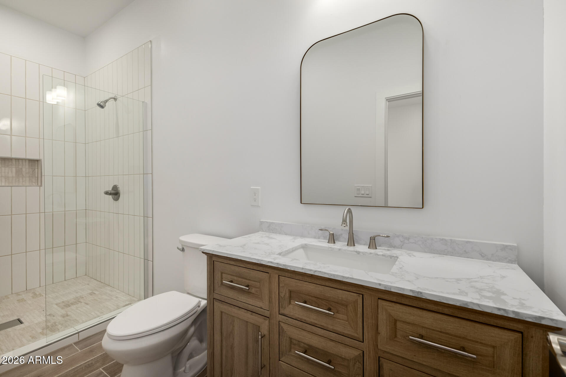 6345 West Grandview Road Glendale, AZ 85306 - Photo 21 of 36 a bathroom with a granite countertop sink toilet and shower