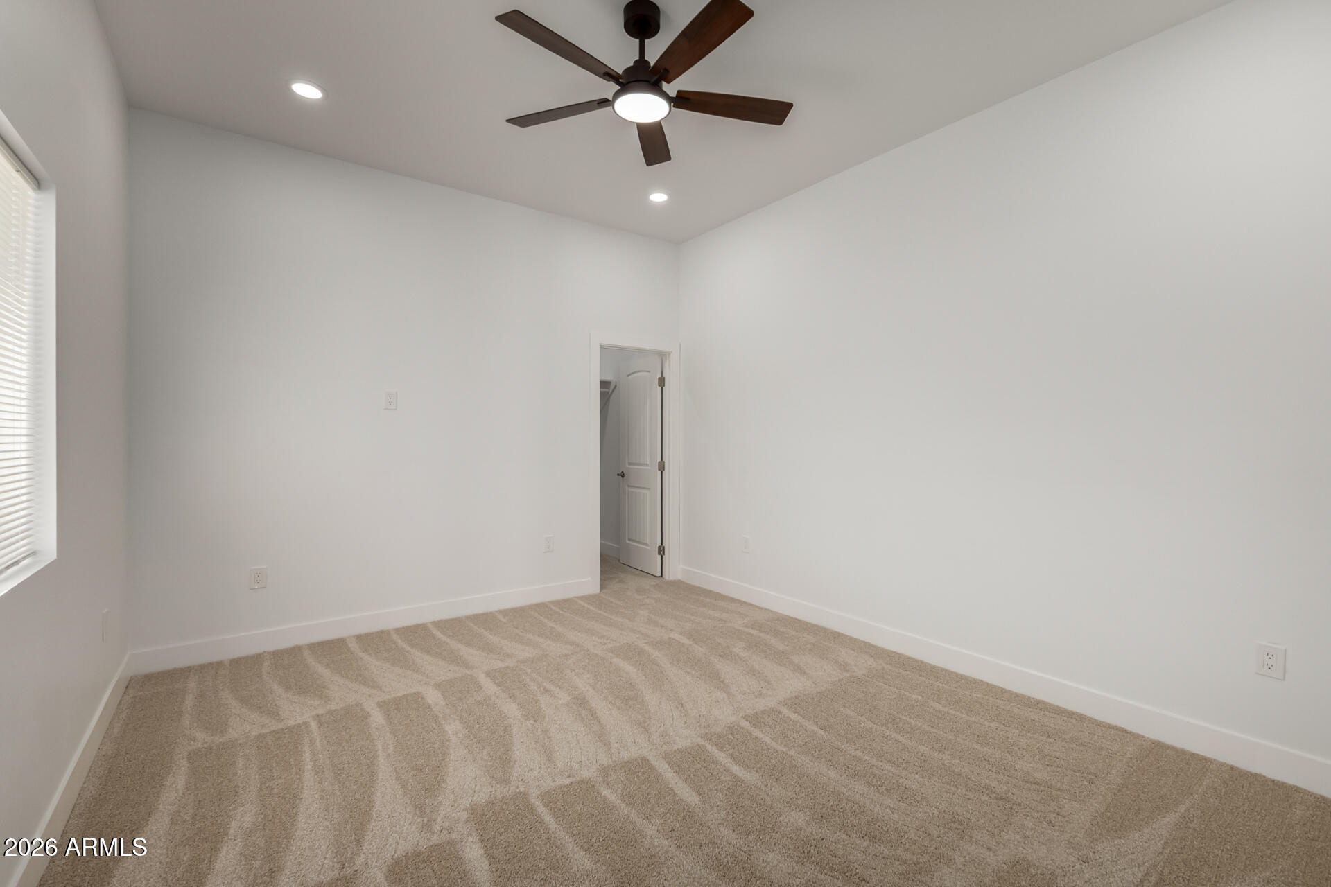 6345 West Grandview Road Glendale, AZ 85306 - Photo 30 of 36 en empty room with ceiling fan and window