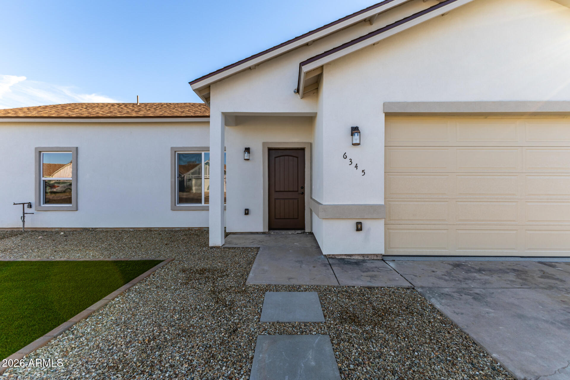 6345 West Grandview Road Glendale, AZ 85306 - Photo 7 of 36 a front view of a house with a yard