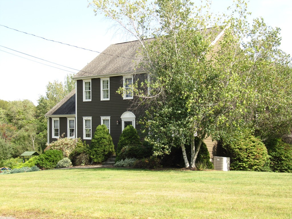 88 McClellan Road Sutton, MA 01590 - Photo 3 of 30 a front view of a house with a yard