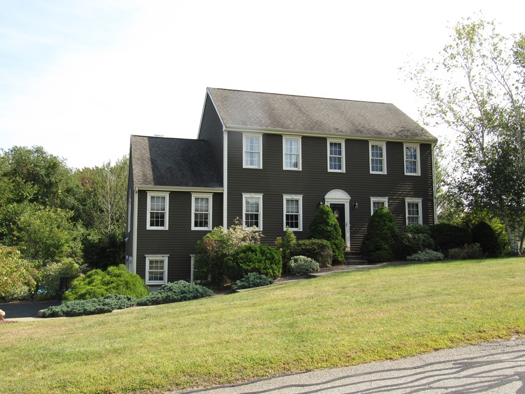 88 McClellan Road Sutton, MA 01590 - Photo 4 of 30 a front view of house with yard and trees around
