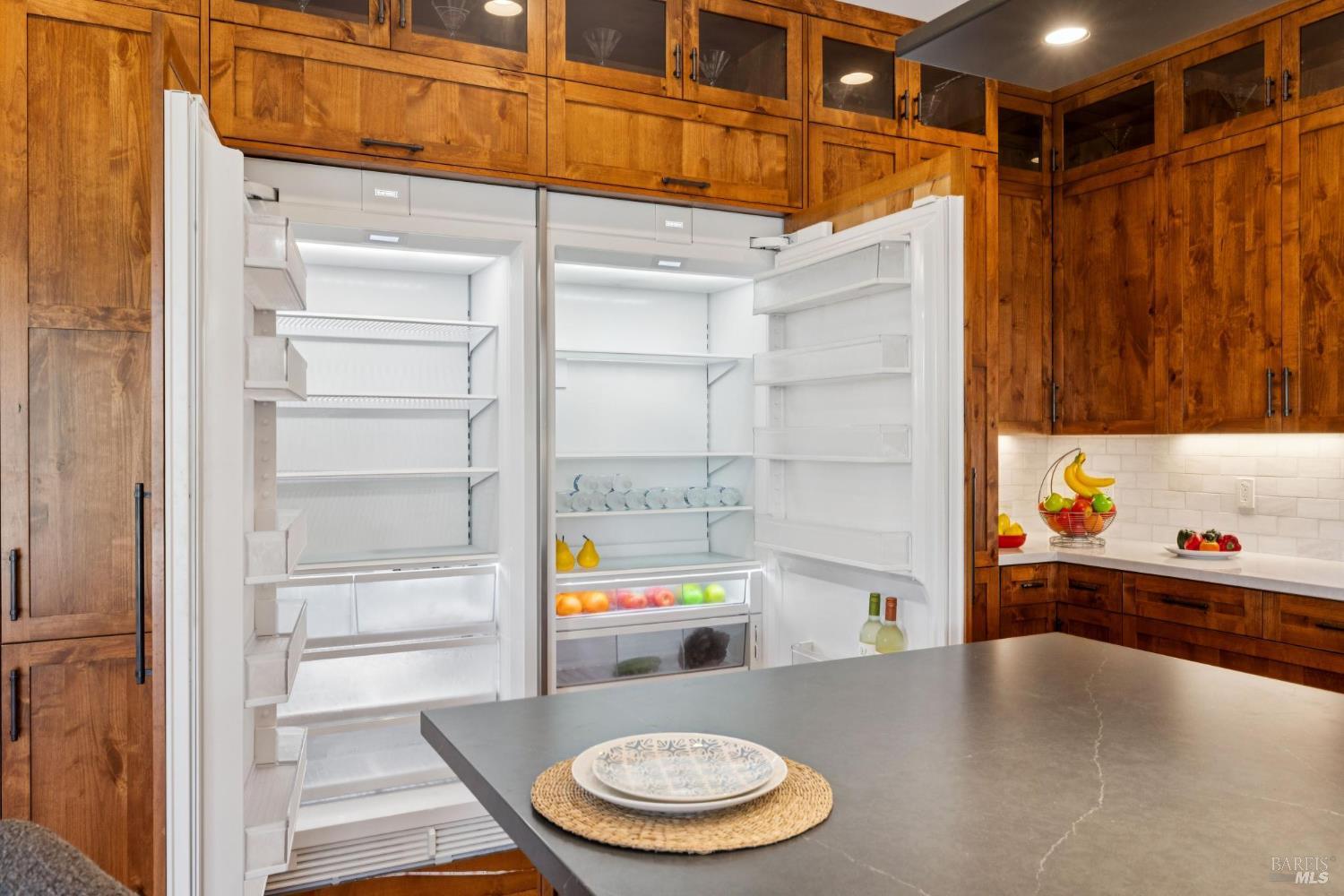3882 Royal Manor Place Santa Rosa, CA 95404 - Photo 17 of 87 The custom kitchen features a built in Sub-Zero refrigerator and Freezer and Knotty Alder cabinetry.