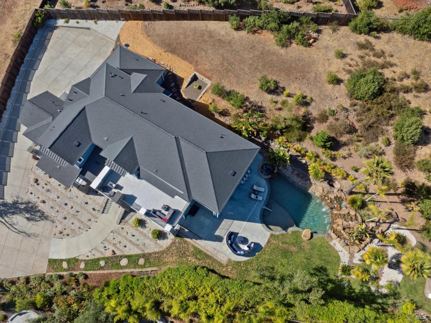 3882 Royal Manor Place Santa Rosa, CA 95404 - Photo 2 of 87 This nearly 1 acre gated parcel has a 3 car garage with room to park many more vehicles. With mature planting of birds of paradise and palms you feel like you are in your own private resort. Much of the acre has beautiful mature landscaping. The back part of the parcel can be left natural or developed to the new owners taste with trees, garden beds, an orchard, play structures or?