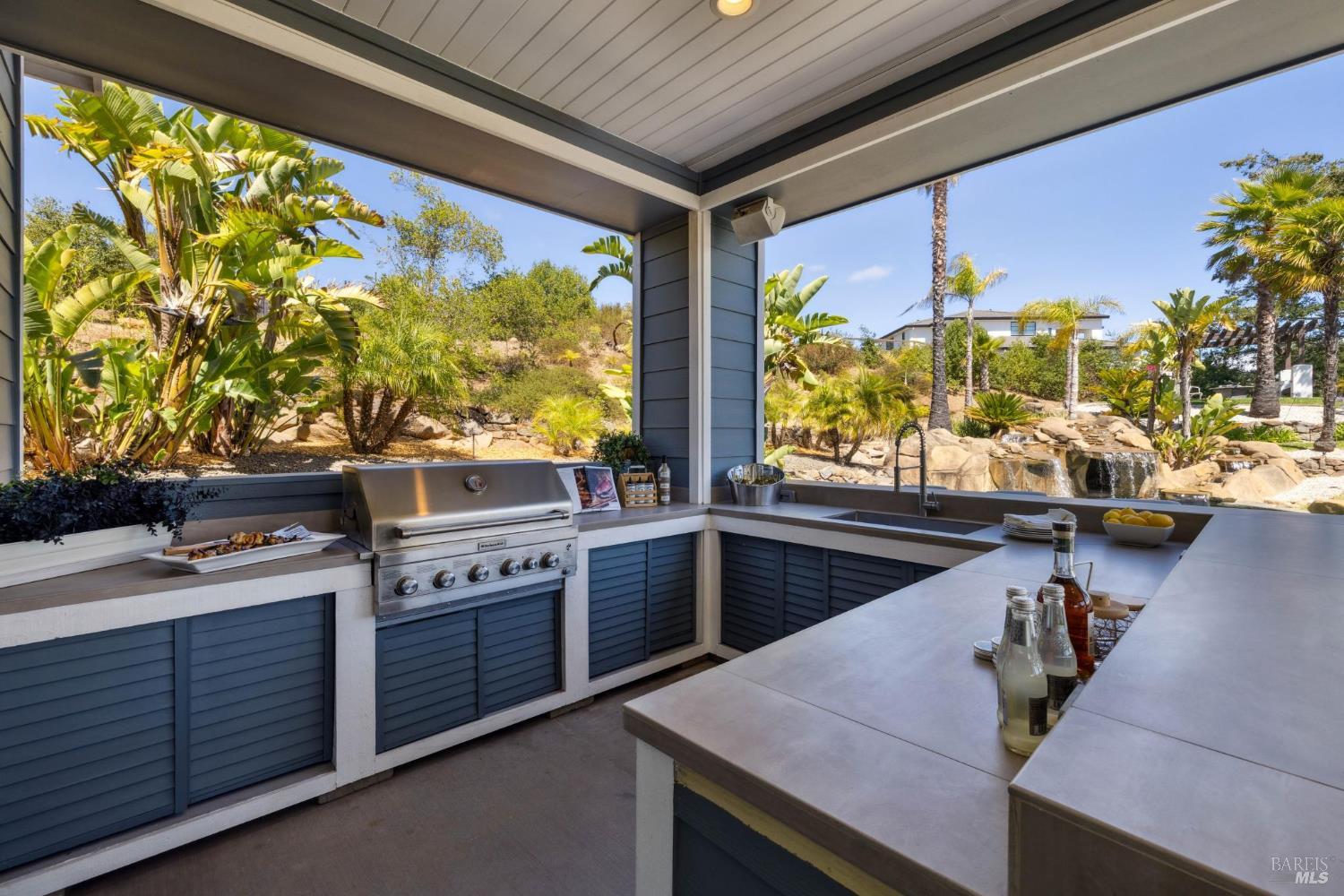 3882 Royal Manor Place Santa Rosa, CA 95404 - Photo 21 of 87 The out-door kitchen is set with a KitchenAid BBQ that has natural gas run to it so you wont need to fill propane tanks, bar seating for 8, outdoor refrigerator, outdoor sink, and plenty of open and shaded seating area.