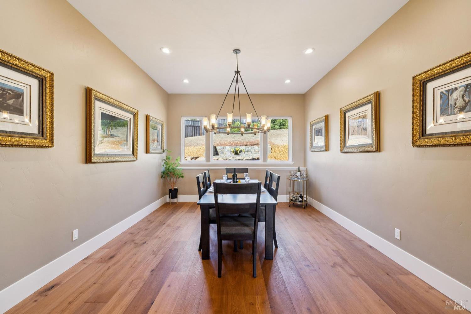 3882 Royal Manor Place Santa Rosa, CA 95404 - Photo 30 of 87 This grand dining room has room to easily seat 10 with the ability to extend the dining into the foyer for a larger dinner party.