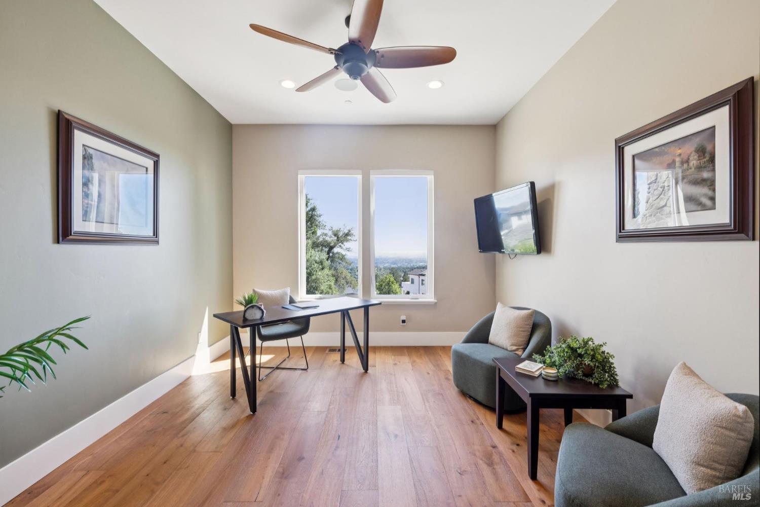 3882 Royal Manor Place Santa Rosa, CA 95404 - Photo 87 of 87 This office is located adjacent to the primary suite has an amazing west facing view. It's proximity to the primary suite would also lend itself to being an ideal nursery. There is another bedroom and full bathroom on the main level. There are 3 bedrooms and 3 full bathrooms located on the second floor. This floor plan was designed to function well for many different buyers.