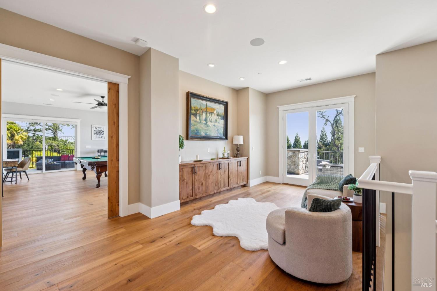 3882 Royal Manor Place Santa Rosa, CA 95404 - Photo 44 of 87 Step upstairs into a well-designed second level with natural light and extensive views out the french doors to your right. The flexible designed upper level includes 3 bedrooms each with full baths, an office, and a large living space near a bedroom and bathroom that can conveniently be transformed from a game room to a private guest suite.