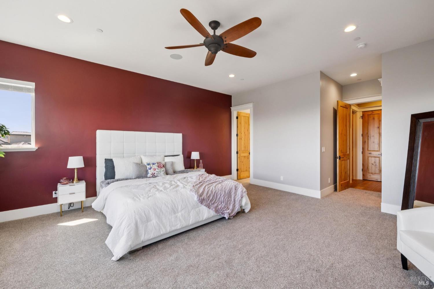 3882 Royal Manor Place Santa Rosa, CA 95404 - Photo 51 of 87 Spacious upstairs primary bedroom includes a walk-in closet and full bathroom. Enjoy bright light and clear views of Sonoma County's hills and mountains out the large dual pane window. The walk-in closet provides ample hanger space, drawers, and shelving for clothes, shoes, and accessories. A door opens into the bathroom that boasts a glass door shower with dual shower heads, a dual pane window for fresh air and natural light, oil rubbed bronze Moen fixtures, and a second door that flows into the hallway.