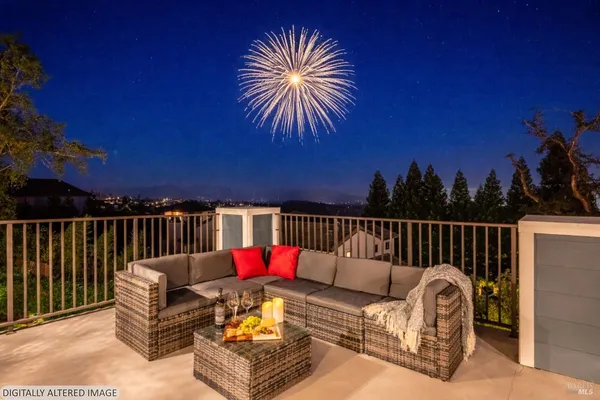 a view of a patio with a table and chairs