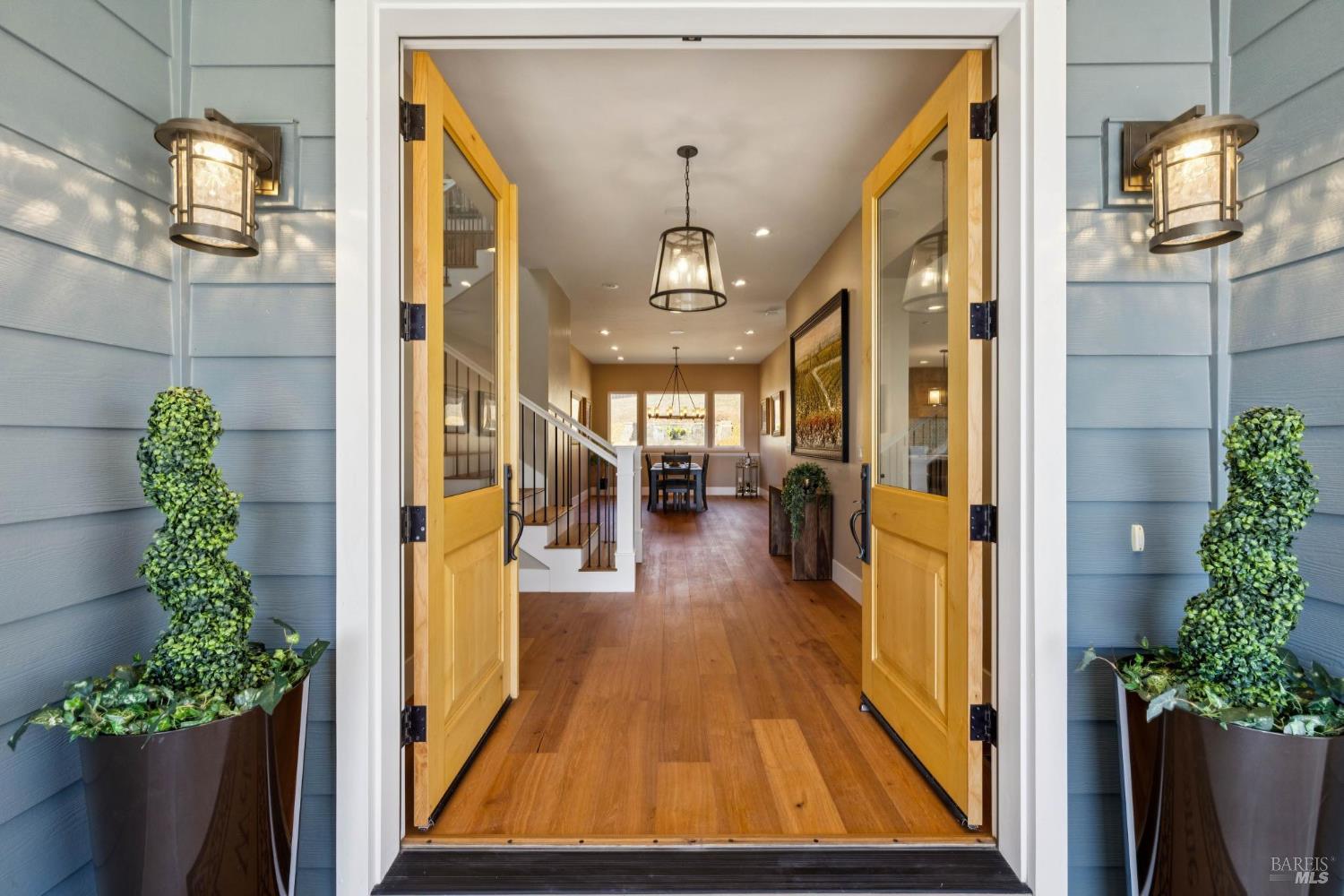 3882 Royal Manor Place Santa Rosa, CA 95404 - Photo 85 of 87 Enter through custom double doors to the inside of the traditionally elegant home with a touch of modern functionality. Greeted with a brightly lit floor plan, to your left is an office and the luxurious primary suite and to the right is the grand kitchen and family room.