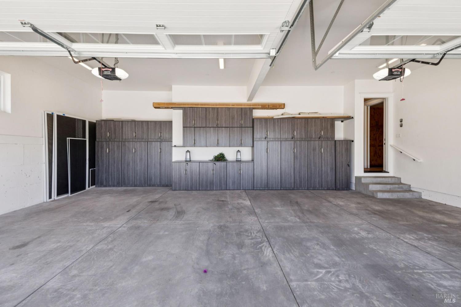 3882 Royal Manor Place Santa Rosa, CA 95404 - Photo 68 of 87 3 car garage with a pre wired electric vehicle charger, storage cabinetry, and a deep sink.