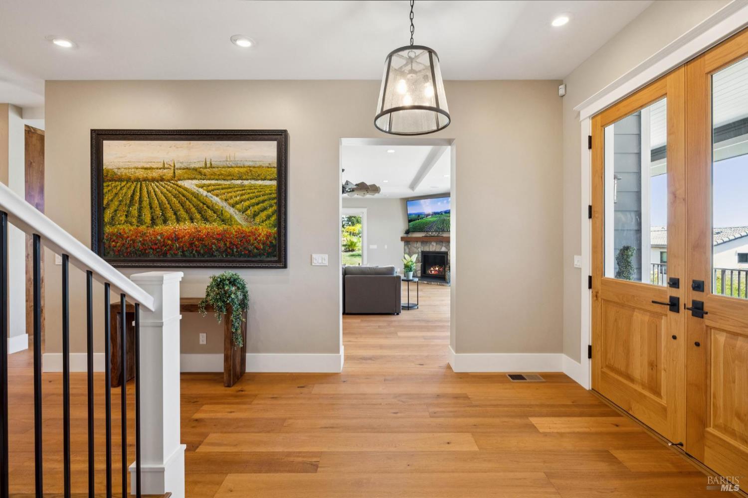 3882 Royal Manor Place Santa Rosa, CA 95404 - Photo 7 of 87 The large custom double doors with windows illuminate this elegant entry with natural light. The builder thoughtfully places recessed lighting as well as directional additional art lighting to illuminate your favorite art pieces.