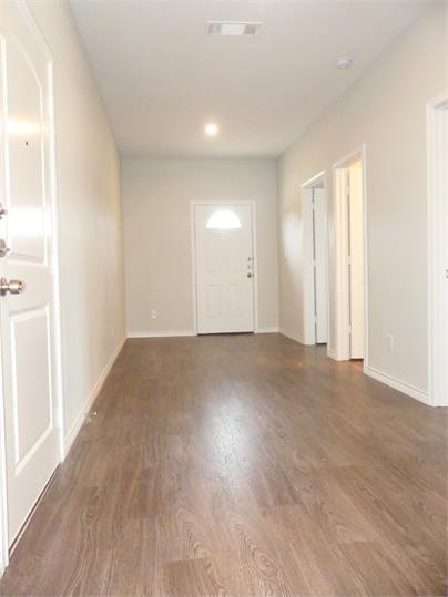 8071 County Road, Unit 436 Princeton, TX 75407 - Photo 3 of 8 a view of an empty room and wooden floor