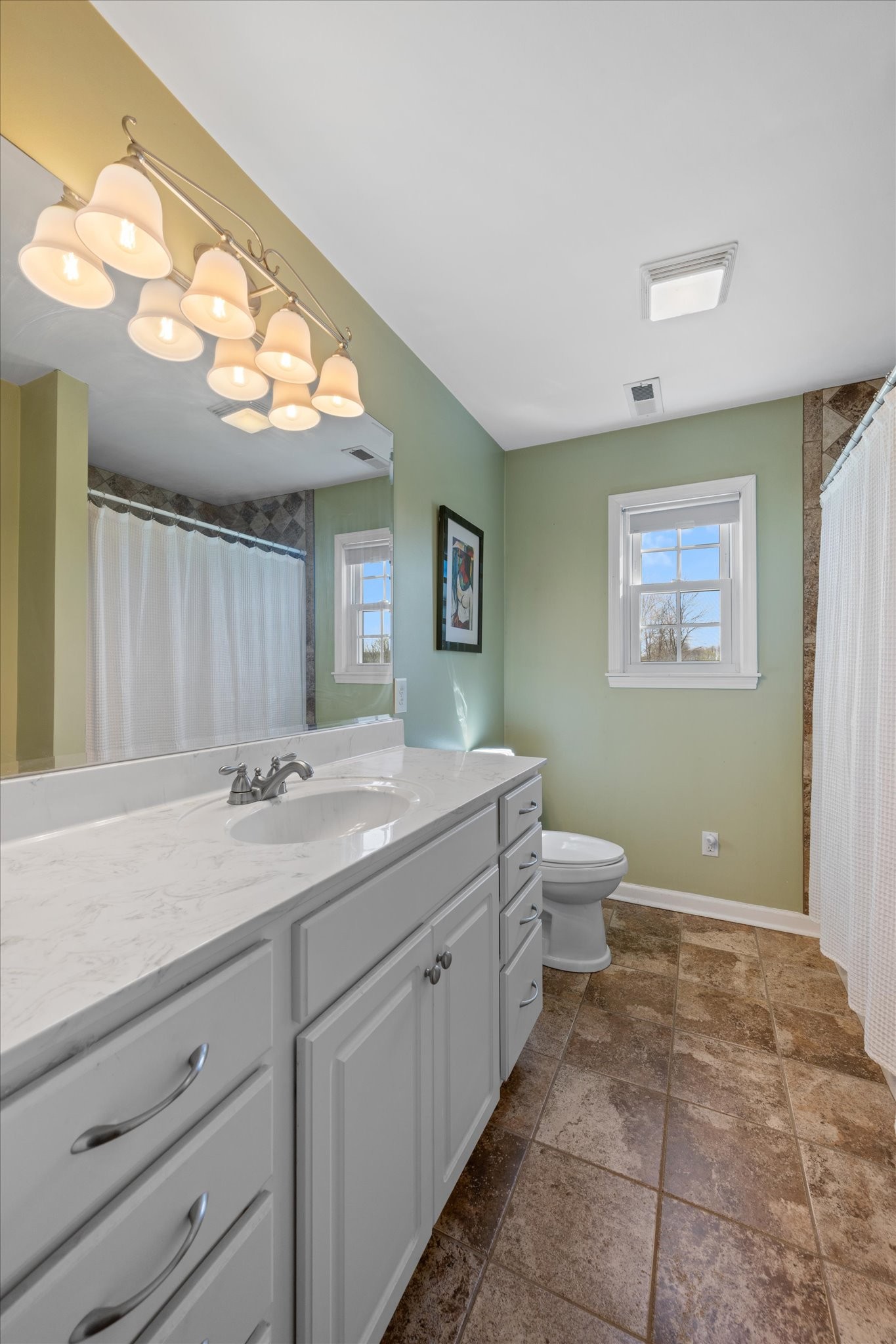 501 Chapmansboro Road Ashland City, TN 37015 - Photo 16 of 36 a bathroom with a toilet a sink and mirror