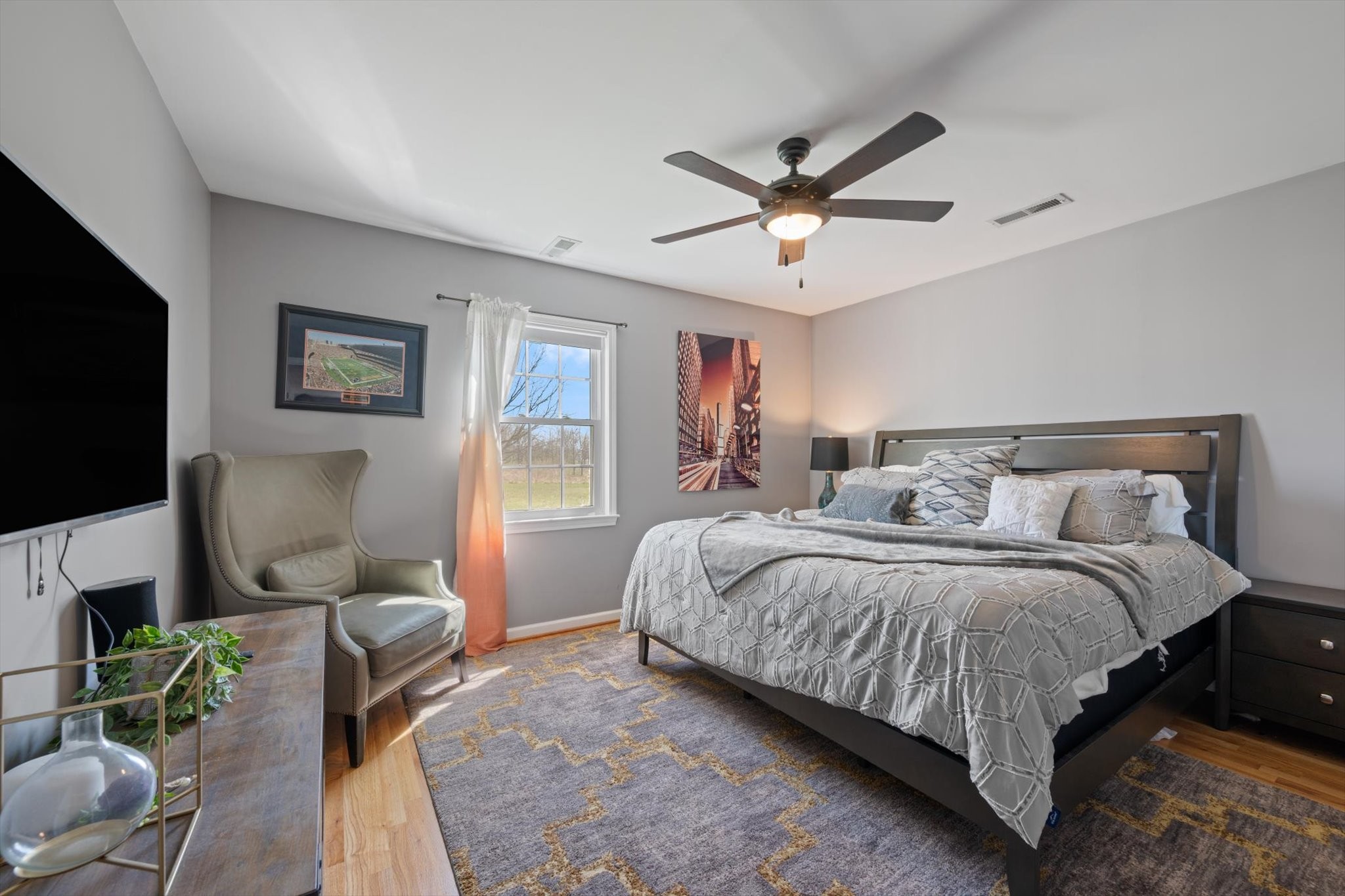 501 Chapmansboro Road Ashland City, TN 37015 - Photo 17 of 36 a spacious bedroom with a bed and a flat screen tv