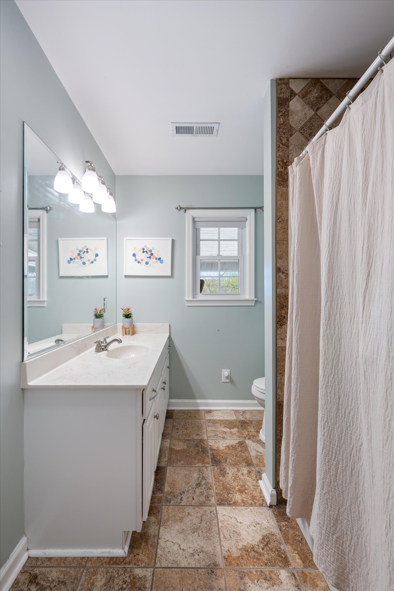 501 Chapmansboro Road Ashland City, TN 37015 - Photo 18 of 36 a bathroom with a sink and mirror