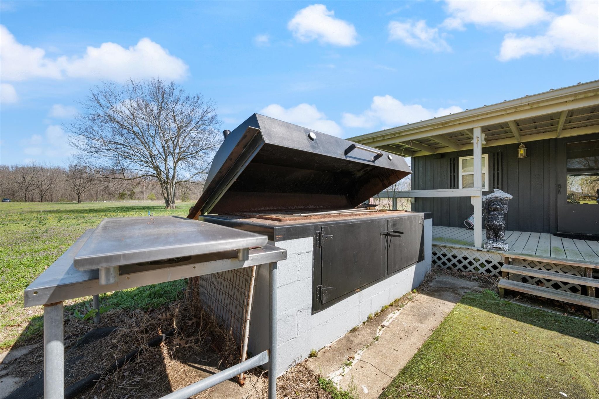 501 Chapmansboro Road Ashland City, TN 37015 - Photo 24 of 36 a view of a backyard with couches chair and a fire pit