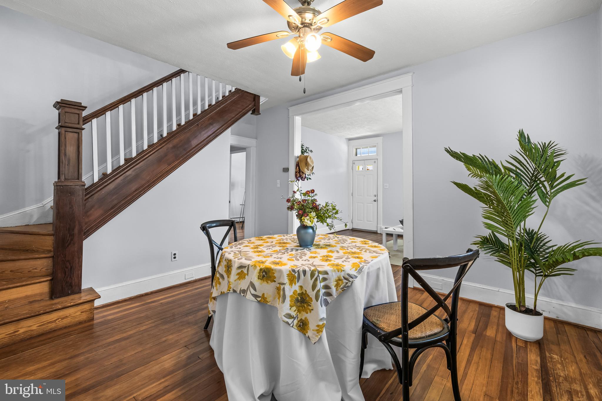 4406 Mainfield Avenue Baltimore, MD 21214 - Photo 11 of 47 a dining room with furniture and wooden floor