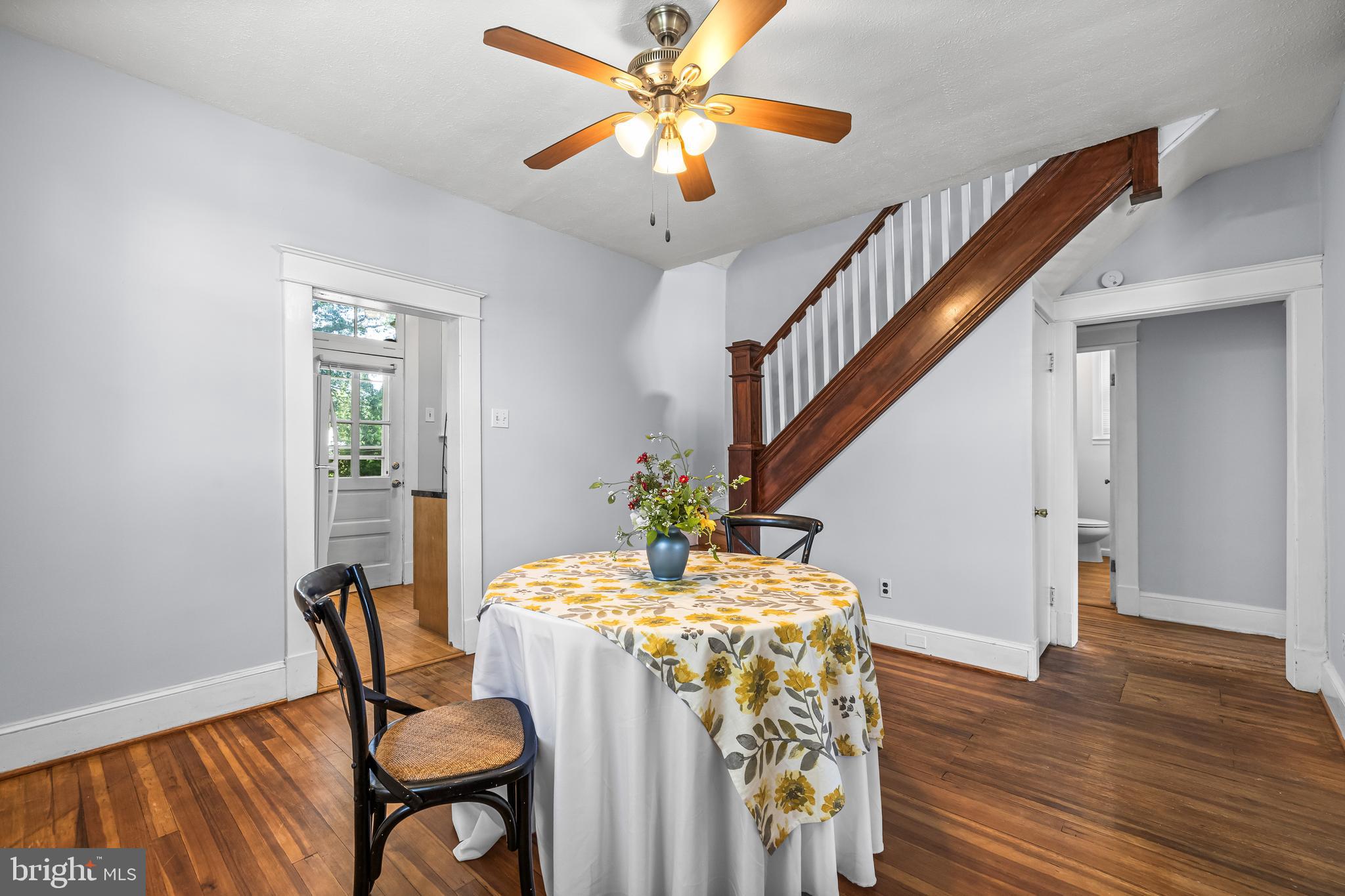 4406 Mainfield Avenue Baltimore, MD 21214 - Photo 12 of 47 a dining room with furniture and wooden floor